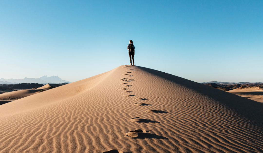 Footprints in desert sands.