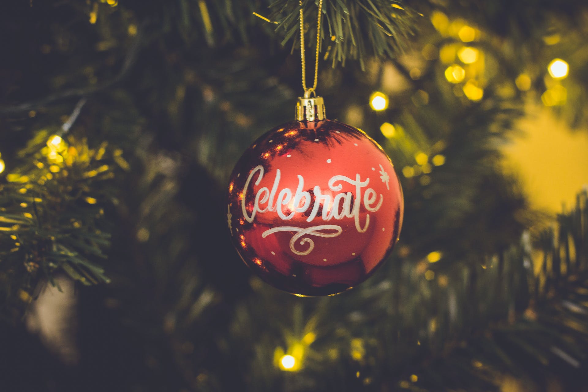 'Celebrate' etched on a Christmas ornament.