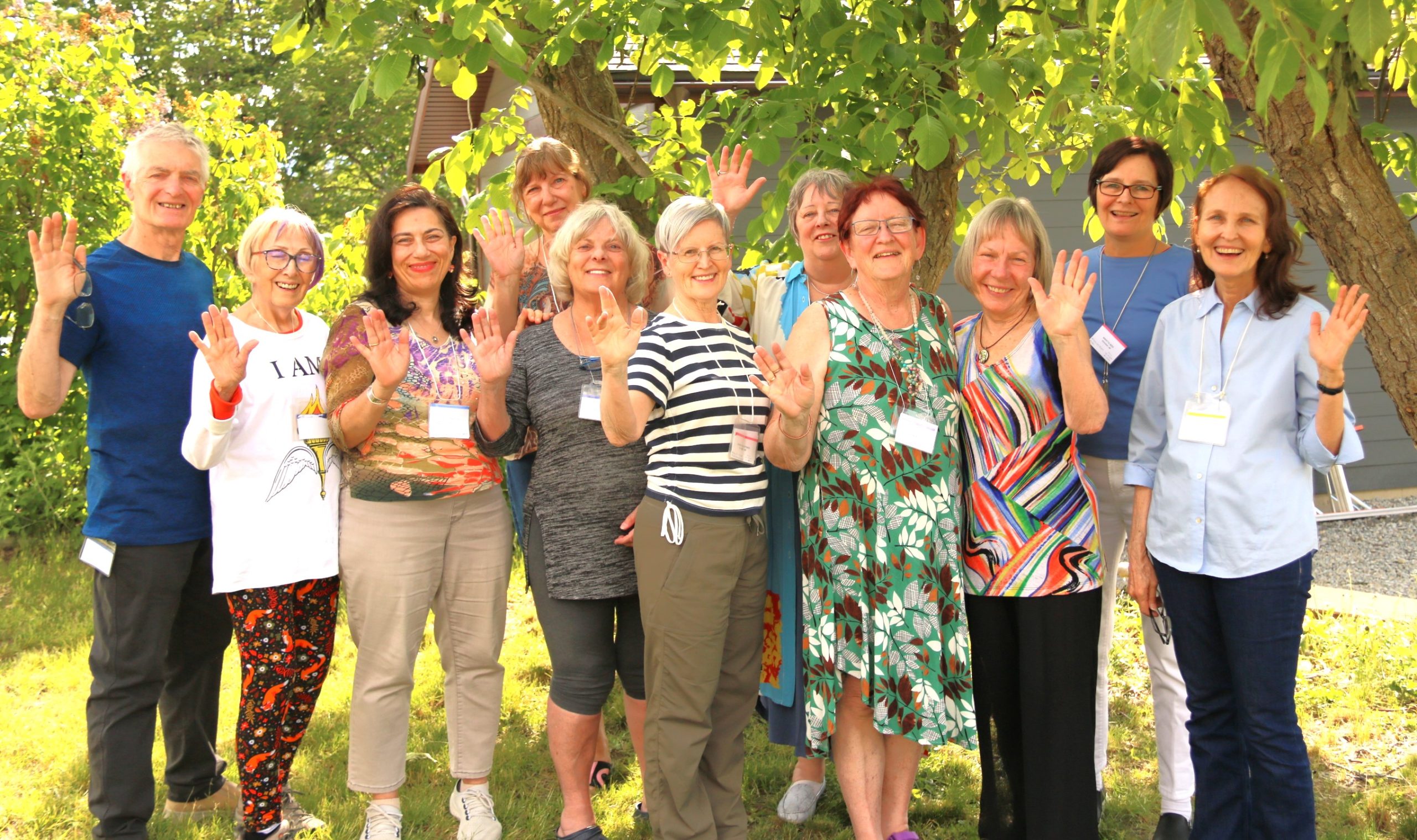 Group of campers waving.