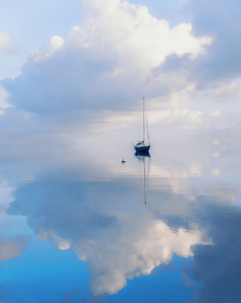 202608_stillness_sailboat_water_clouds_crop_scale A sail boat at rest somewhere between ocean and sky.